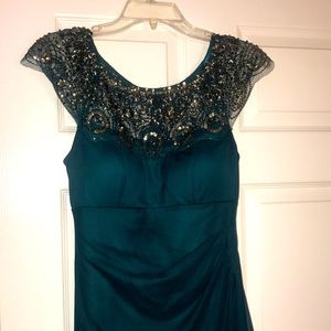Emerald green evening dress. Size: 4. Beaded neck.